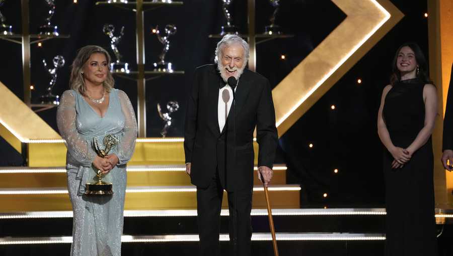 Dick Van Dyke accepts the award for outstanding guest performance in a daytime drama series for &quot;Days of our Lives&quot; during the 51st Daytime Emmy Awards on Friday, June 7, 2024, at the Westin Bonaventure in Los Angeles. Arlene Silver looks on from left.(AP Photo/Chris Pizzello)