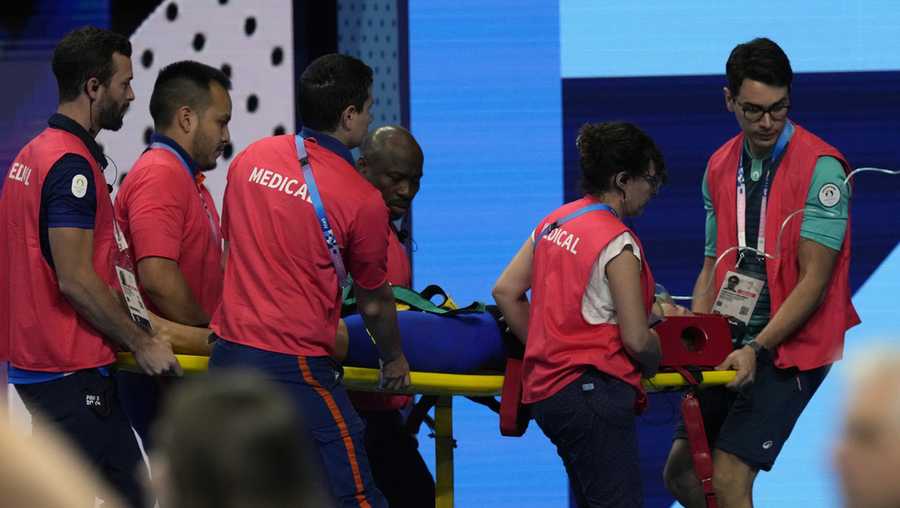 Slovakia’s Tamara Potocka is taken on stretcher from the pool deck after collapsing following a heat of the women's 200-meter individual medley at the 2024 Summer Olympics, Friday, Aug. 2, 2024, in Nanterre, France.