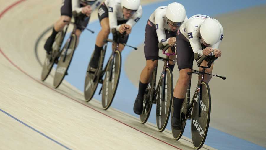 United States' Jennifer Valente, Lily Williams, Chloe Dygert and Kristen Faulkner compete on their way to clinch the gold medal in the women's team pursuit event, at the Summer Olympics, Wednesday, Aug. 7, 2024, in Paris, France. (AP Photo/Ricardo Mazalan)