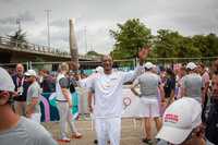 Rapper Snoop Dog carries the Olympic flame during the last stage of the Olympic torch before the Olympic Games 2024 opening ceremony in Seine-Saint-Denis, France on July 26, 2024 (Photo by Victoria Valdivia / Hans Lucas / Hans Lucas via AFP) (Photo by VICTORIA VALDIVIA/Hans Lucas/AFP via Getty Images)