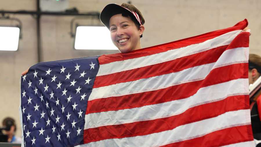 CHATEAUROUX, FRANCE - AUGUST 02: Silver medalist Sagen Maddalena of Team United States celebrates with a Team United States flag following the Women&apos;s 50m Rifle 3 Positions Final on day seven of the Olympic Games Paris 2024 at Chateauroux Shooting Centre on August 02, 2024 in Chateauroux, France. (Photo by Charles McQuillan/Getty Images)