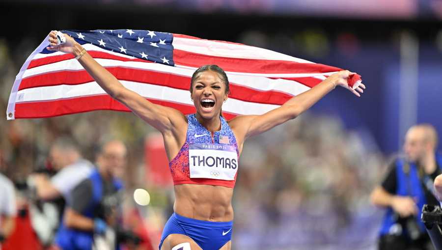 Gabrielle Thomas celebrates after winning the women's 200m final of the athletics event at the Paris 2024 Olympic Games at Stade de France in Saint-Denis