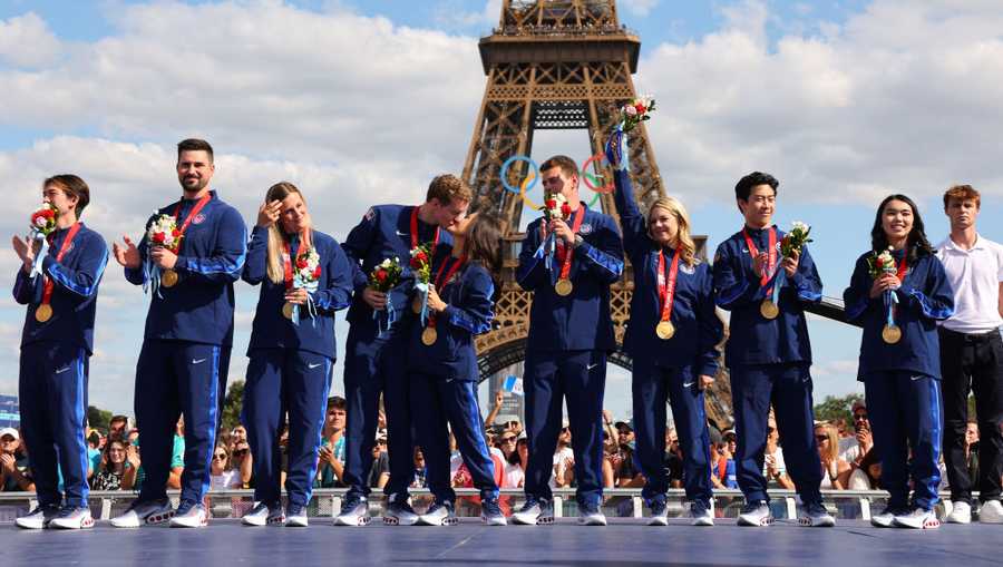 Members of the U.S. Olympic figure skating team pose for a photo after receiving gold medals following the disqualification of Team Russia for doping after the 2022 Winter Games in Beijing