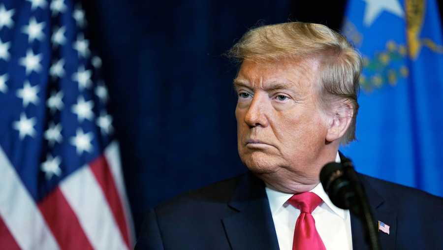 In this Wednesday, Oct. 28, 2020, file photo, former President Donald Trump listens as Nevada business leaders talk at Trump International Hotel Las Vegas, in Las Vegas.